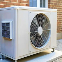 Bosanac outdoor heat pump unit with large fan installed on a concrete platform beside a brick wall. Bosanac outdoor heat pump unit with large fan installed on a concrete platform beside a brick wall.