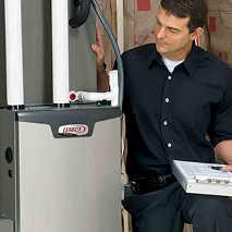 A Bosanac professional technician inspects a Lennox heating unit, holding a clipboard and reviewing system components indoors. A Bosanac professional technician inspects a Lennox heating unit, holding a clipboard and reviewing system components indoors.